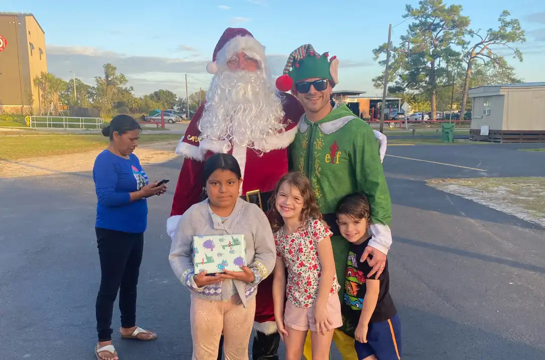 Group of children posing with Santa for a picture