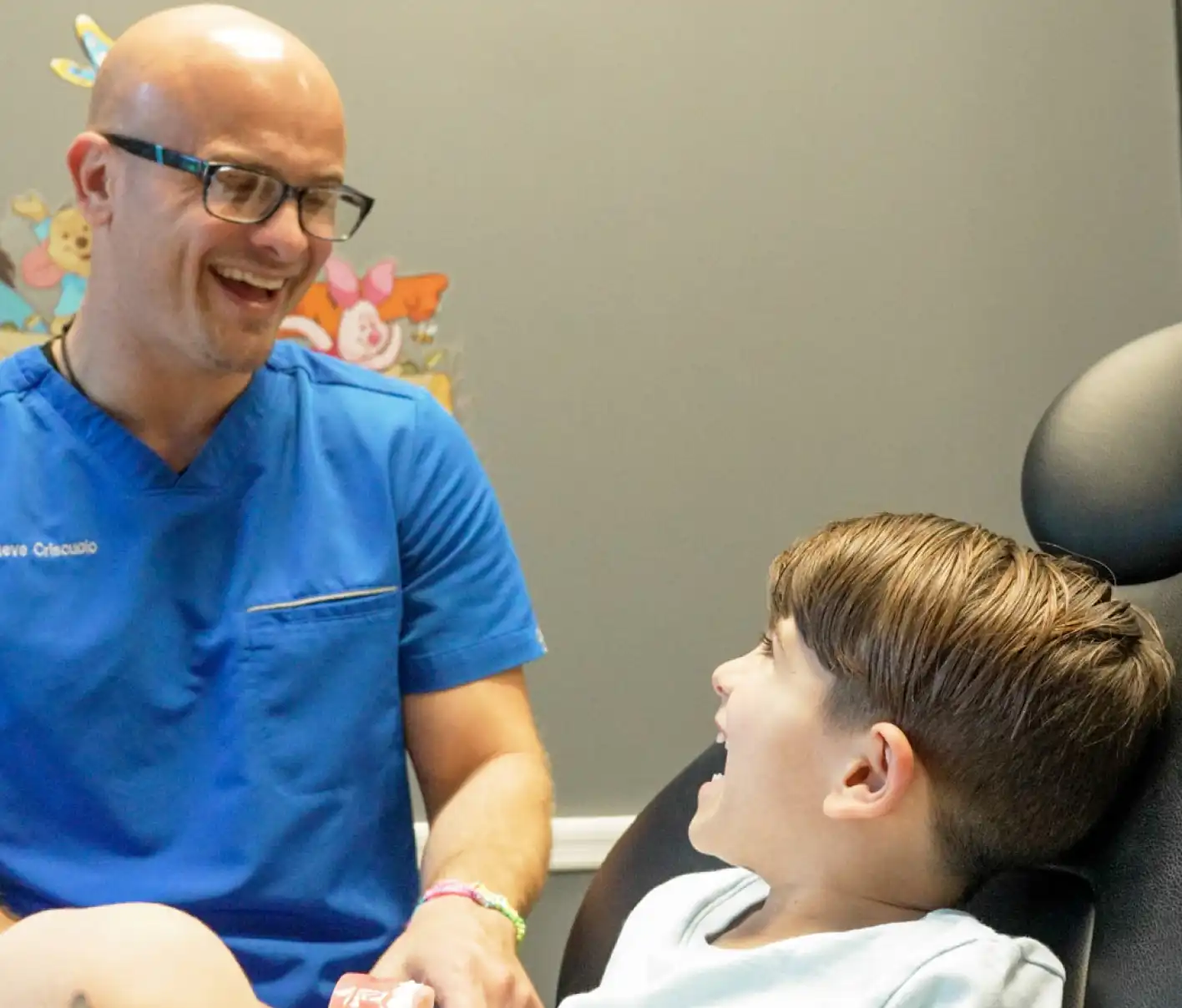 Dentist talking to child about their teeth